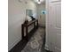 Bright hallway with stylish console table and rug at 1887 Plainsboro Dr, Lithonia, GA 30058