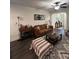 Living room with brown sofa and entryway view at 1887 Plainsboro Dr, Lithonia, GA 30058