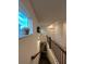 Upstairs hallway with window and second staircase at 1887 Plainsboro Dr, Lithonia, GA 30058