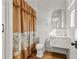 Small bathroom with marble vanity and patterned shower curtain at 230 Central Ave, Fayetteville, GA 30214