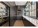 Elegant butler's pantry with dark cabinetry, marble countertops, and ample storage at 230 Central Ave, Fayetteville, GA 30214