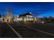 Luxury home exterior beautifully illuminated at night at 230 Central Ave, Fayetteville, GA 30214