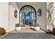 Elegant arched entryway with black metal framed glass doors at 230 Central Ave, Fayetteville, GA 30214