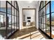 Sunlit hallway with herringbone floors and access to living room at 230 Central Ave, Fayetteville, GA 30214