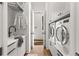 Bright laundry room with washer, dryer, and ample storage at 230 Central Ave, Fayetteville, GA 30214