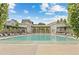 Resort-style pool with surrounding lounge chairs and cabanas at 230 Central Ave, Fayetteville, GA 30214