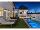 Evening view of a luxurious pool and patio area at 230 Central Ave, Fayetteville, GA 30214