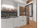 Modern wet bar with wine cooler and ample storage at 230 Central Ave, Fayetteville, GA 30214