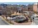 Aerial view of community with central green space and firepit at 393 Summerhour St, Marietta, GA 30060