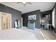 Main bedroom with dark gray walls, carpeted floors, and workspace at 393 Summerhour St, Marietta, GA 30060