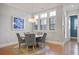 Elegant dining room features hardwood floors and a round wooden table at 393 Summerhour St, Marietta, GA 30060