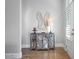 Bright entryway with wood floors, console table, and unique wall art at 393 Summerhour St, Marietta, GA 30060