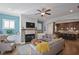 Open living area with a view into the kitchen and a cozy fireplace at 393 Summerhour St, Marietta, GA 30060