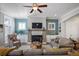 Open living room with fireplace, ceiling fan, and built-in shelving at 393 Summerhour St, Marietta, GA 30060