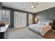 Spacious main bedroom with plush carpet and private access to outdoor patio at 393 Summerhour St, Marietta, GA 30060