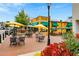 Outdoor seating area with umbrellas and flowerbeds at 393 Summerhour St, Marietta, GA 30060