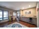 Basement bar with granite countertop and wine cooler at 5041 Towne Lake N Hls, Woodstock, GA 30189