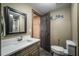 Basement bathroom with shower, toilet and vanity at 5041 Towne Lake N Hls, Woodstock, GA 30189