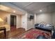 Small basement bedroom with daybed and hardwood floors at 5041 Towne Lake N Hls, Woodstock, GA 30189