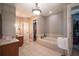 Bathroom boasts a large soaking tub, double vanity, and walk-in closet at 5041 Towne Lake N Hls, Woodstock, GA 30189