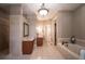 Spa-like bathroom with a soaking tub, double vanity, and separate shower at 5041 Towne Lake N Hls, Woodstock, GA 30189