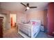 Cozy bedroom with full bed, pink walls and ceiling lights at 5041 Towne Lake N Hls, Woodstock, GA 30189