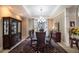 Bright dining room with a large bay window, hardwood floors, and a beautiful chandelier at 5041 Towne Lake N Hls, Woodstock, GA 30189