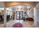 Two-story foyer with tile flooring, chandelier, and curved staircase at 5041 Towne Lake N Hls, Woodstock, GA 30189