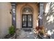 Impressive entryway with double doors and stone flooring at 5041 Towne Lake N Hls, Woodstock, GA 30189