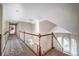 Upper level hallway offering an open and bright atmosphere at 5041 Towne Lake N Hls, Woodstock, GA 30189