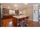 Island kitchen with granite countertops and hardwood floors at 5041 Towne Lake N Hls, Woodstock, GA 30189