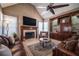 Relaxing living room with fireplace and built-in shelving at 5041 Towne Lake N Hls, Woodstock, GA 30189