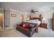 Spacious main bedroom with a king bed, leather sofa, and private bathroom access at 5041 Towne Lake N Hls, Woodstock, GA 30189