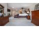 Large main bedroom with king bed, sitting area, and ample closet space at 5041 Towne Lake N Hls, Woodstock, GA 30189