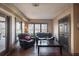 Basement sitting area with leather sofas and large windows at 5041 Towne Lake N Hls, Woodstock, GA 30189