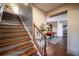 Elegant staircase leading to the lower level at 5041 Towne Lake N Hls, Woodstock, GA 30189