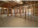 Unfinished basement with framed walls and open space at 1206 Persimmon Way, Mcdonough, GA 30252