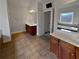 Double vanity bathroom with tile flooring and large soaking tub at 1206 Persimmon Way, Mcdonough, GA 30252
