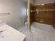 Updated bathroom with soaking tub, tile flooring, and modern vanity at 1206 Persimmon Way, Mcdonough, GA 30252