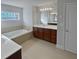 Bathroom with a garden tub, double vanity, and tiled floors at 1206 Persimmon Way, Mcdonough, GA 30252