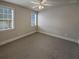 Spacious bedroom with ceiling fan and neutral carpeting at 1206 Persimmon Way, Mcdonough, GA 30252