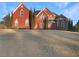 Brick house with a large front yard, two-story design, and ample windows at 1206 Persimmon Way, Mcdonough, GA 30252