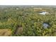 Wide aerial view of expansive property with several ponds at 992 Pj East Rd, Covington, GA 30014