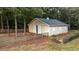 Tan barn with a gray roof, offering ample storage at 992 Pj East Rd, Covington, GA 30014
