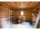Barn storage area with shelves and various tools at 992 Pj East Rd, Covington, GA 30014