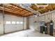 Unfinished basement garage with overhead door and ample storage space at 992 Pj East Rd, Covington, GA 30014