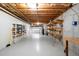 Unfinished basement garage with shelving and workbench at 992 Pj East Rd, Covington, GA 30014