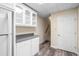 Basement kitchenette with white cabinets and gray countertops at 992 Pj East Rd, Covington, GA 30014