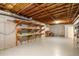 Unfinished basement area with shelving for storage at 992 Pj East Rd, Covington, GA 30014