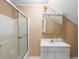 Small bathroom with shower/tub combo and white vanity at 992 Pj East Rd, Covington, GA 30014